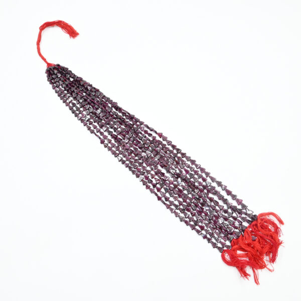 Close-up of Triangle Shaped Garnet Beads – Red Gemstone Strand
