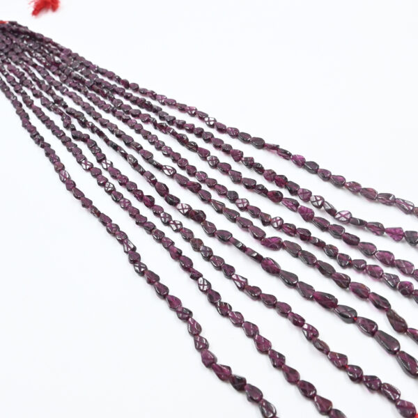 Close-up of Garnet Carving Beads in Pear Shape – Red Gemstones