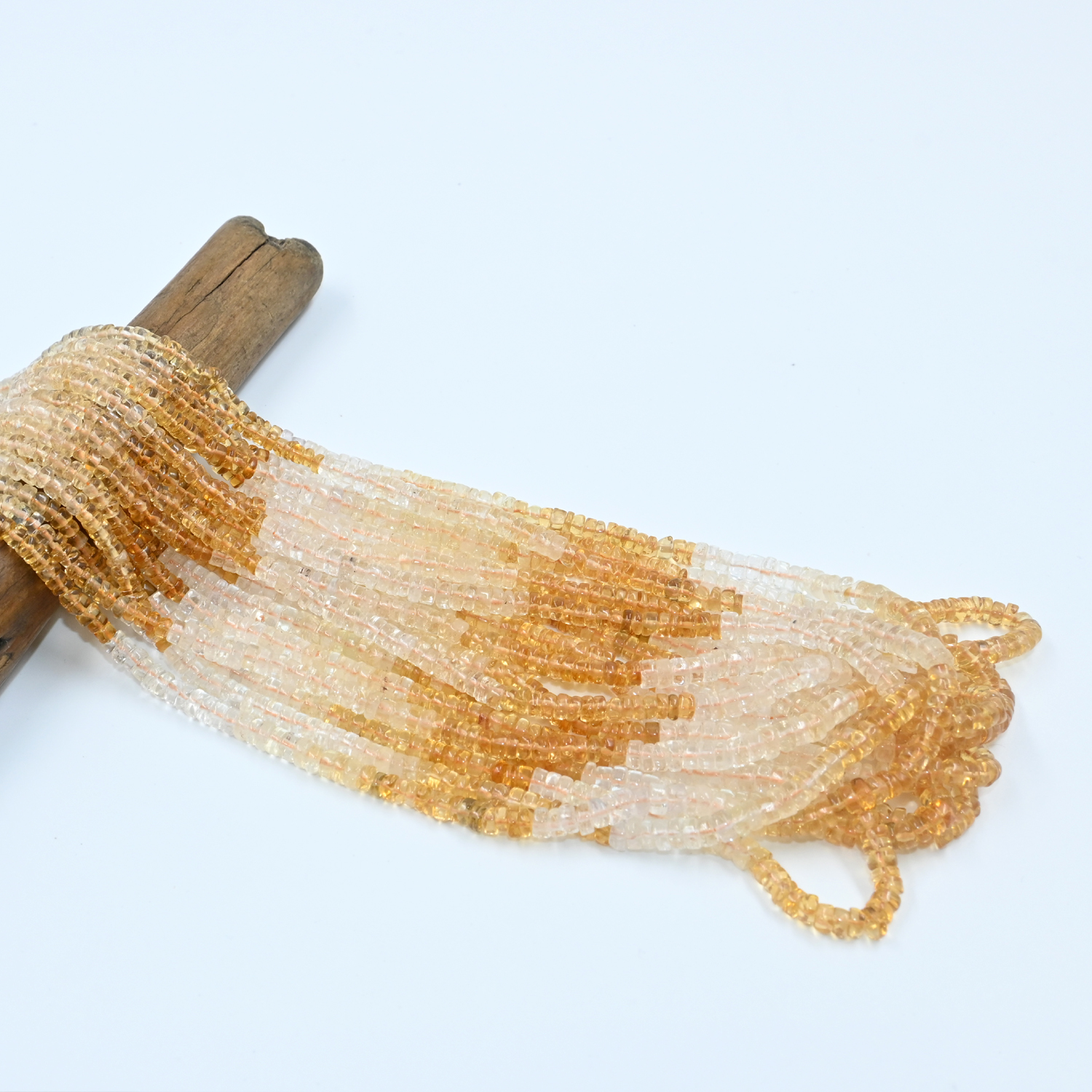 Buy natural citrine shaded heishe beads, 4x4.5mm size, 16" strand. Perfect for handmade jewelry